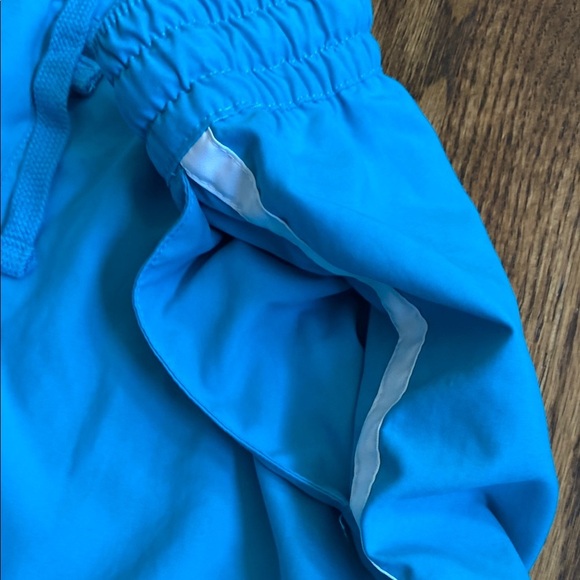 Bright turquoise with white side stripe Nike shorts with pockets, size women’s L - Picture 13 of 16